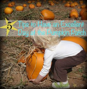 girl picking up pumpkin